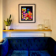 Load image into Gallery viewer, Lights of Mong Kok Hong Kong architecture street photography by Richard Heeps framed in black on the living room wall.