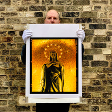 Load image into Gallery viewer, Richard Heeps holding Italian religious iconography print.