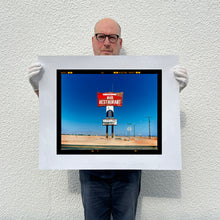 Load image into Gallery viewer, Richard Heeps holding Sundowner Salton Sea California print.