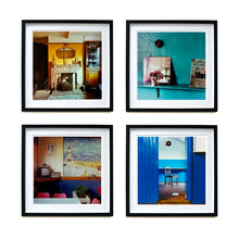 Load image into Gallery viewer, Four black framed photographs by Richard Heeps. From Richard's series Ordinary Places, the four photos capture vintage indoor scenes. The first one is a sitting room with a fireplace and candlesticks, the second a shelf with a mirror and a small bunch of flowers, the third is in the Fisherman's mission in the cafe with an old tv sitting in the corner, the fourth is through a blue door and you see a chair sitting by itself.
