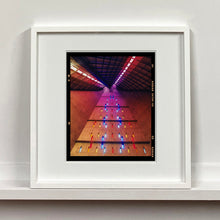 Load image into Gallery viewer, White framed photograph by Richard Heeps. Stained glass windows on the interior of San Giovanni Bono Church, a concrete brutalist building in Milan by Italian architect Arrigo Arrighetti. 