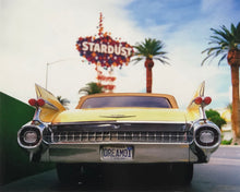 Load image into Gallery viewer, Photograph by Richard Heeps.  The back end of the classic American car with a number place DREAM01 sits underneath the STARDUST casino sign.