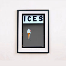 Load image into Gallery viewer, Black framed photograph by Richard Heeps.  At the top black letters spell out ICES and below is depicted a 99 icecream cone sitting left of centre against a grey coloured background.  