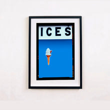 Load image into Gallery viewer, Black framed photograph by Richard Heeps.  At the top black letters spell out ICES and below is depicted a 99 icecream cone sitting left of centre against a sky blue coloured background.  
