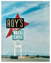 Load image into Gallery viewer, Photograph by Richard Heeps. A roadside sign on Route 66 in America. The word ROY'S appears in a black sign with a big red arrow pointing to the left ground, below this VACANCY and on a green square the words MOTEL and CAFE.