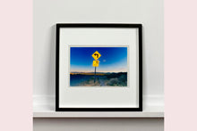Load image into Gallery viewer, Part of Richard Heeps' 'Dream in Colour' Series, this beautiful picture taken at dusk captures the sunset in the valley.  It was photographed in what was once a goldmine, now a ghost town. The 5MPH sign seems so cautious, but on closer inspection you see that it is peppered with bullet holes, serving as a reminder of its Western past. 