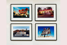 Load image into Gallery viewer, 'Adult Entertainment' photographed in Beatty, Nevada, shows bold typography sitting prominently on an American road sign, against a background of bright blue sky. This fun and cheeky artwork was captured on a road trip through America and features in Richard Heeps' sold out book 'Man's Ruin'. An edition of this artwork recently sold at auction in The Auction Collective exhibition 'Hypercolor-Pop-Culture'.