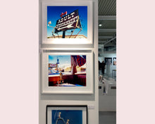 Load image into Gallery viewer, 'Adult Entertainment' photographed in Beatty, Nevada, shows bold typography sitting prominently on an American road sign, against a background of bright blue sky. This fun and cheeky artwork was captured on a road trip through America and features in Richard Heeps' sold out book 'Man's Ruin'. An edition of this artwork recently sold at auction in The Auction Collective exhibition 'Hypercolor-Pop-Culture'.