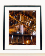 Load image into Gallery viewer, Light breaks through the cracks in the barn on the movie set of Clint Eastwood's Western film 'The Outlaw Josey Wales'. Captured in Kanab, Utah, which was the setting of many Western movies. Photographed by Richard Heeps for his 'Dream in Colour' series.
