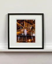 Load image into Gallery viewer, Light breaks through the cracks in the barn on the movie set of Clint Eastwood's Western film 'The Outlaw Josey Wales'. Captured in Kanab, Utah, which was the setting of many Western movies. Photographed by Richard Heeps for his 'Dream in Colour' series.