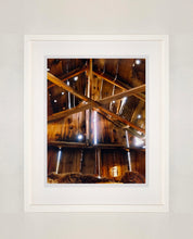 Load image into Gallery viewer, Light breaks through the cracks in the barn on the movie set of Clint Eastwood's Western film 'The Outlaw Josey Wales'. Captured in Kanab, Utah, which was the setting of many Western movies. Photographed by Richard Heeps for his 'Dream in Colour' series.