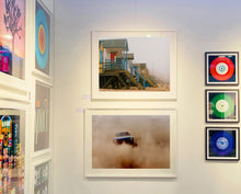 Load image into Gallery viewer, 'Beach Huts', photographed by Richard Heeps in one of his favourite areas of the UK, the port town of Wells-next-the-sea, Norfolk. This piece captures the classic quintessential beach hut on an atmospherically foggy day.