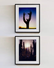 Load image into Gallery viewer, The silhouette of a large scale cactus, dressed in twinkle lights, set against an ombre twilight sky. Photographed by Richard Heeps in the Arizona desert, for his 'Dream in Colour' series.