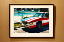 Load image into Gallery viewer, An American car parked up by the swimming pool outside the Algiers Hotel in Las Vegas. Photography by Richard Heeps, part of his 'Dream in Colour' series.