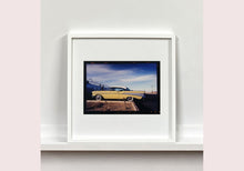 Load image into Gallery viewer, 'Chevy at the Diner' was photographed in Bisbee, Arizona in 2001 but printed by Richard in his darkroom for the first time more recently in 2018. This cinematic artwork that features a vintage yellow chevy parked up at a Diner will take you on an American road trip. 