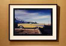 Load image into Gallery viewer, 'Chevy at the Diner' was photographed in Bisbee, Arizona in 2001 but printed by Richard in his darkroom for the first time more recently in 2018. This cinematic artwork that features a vintage yellow chevy parked up at a Diner will take you on an American road trip. 