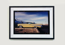 Load image into Gallery viewer, 'Chevy at the Diner' was photographed in Bisbee, Arizona in 2001 but printed by Richard in his darkroom for the first time more recently in 2018. This cinematic artwork that features a vintage yellow chevy parked up at a Diner will take you on an American road trip. 