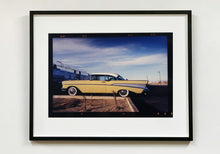 Load image into Gallery viewer, 'Chevy at the Diner' was photographed in Bisbee, Arizona in 2001 but printed by Richard in his darkroom for the first time more recently in 2018. This cinematic artwork that features a vintage yellow chevy parked up at a Diner will take you on an American road trip. 