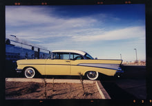 Load image into Gallery viewer, 'Chevy at the Diner' was photographed in Bisbee, Arizona in 2001 but printed by Richard in his darkroom for the first time more recently in 2018. This cinematic artwork that features a vintage yellow chevy parked up at a Diner will take you on an American road trip. 