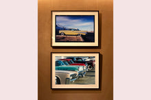 Load image into Gallery viewer, 'Chevy at the Diner' was photographed in Bisbee, Arizona in 2001 but printed by Richard in his darkroom for the first time more recently in 2018. This cinematic artwork that features a vintage yellow chevy parked up at a Diner will take you on an American road trip. 