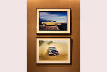 Load image into Gallery viewer, 'Donut' shows a classic American car donut driving on a Norfolk beach in the East of England. This photograph was captured at Hemsby Rock and Roll weekend, and is part of Richard Heeps' Man's Ruin' series.