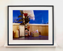Load image into Gallery viewer, 'Condiments' shows a classic American Diner table-scape, captured at the Bonanza Café in the small town of Lone Pine, California. This piece is part of Richard Heeps' 'Dream in Colour' series.