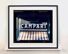 Load image into Gallery viewer, Cordial Campari, photographed as part of Richard Heeps’ series 'A Short History of Milan’ features beautiful and bold typography above the striped awning of a fascist building. 