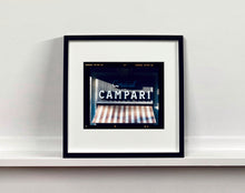Load image into Gallery viewer, Cordial Campari, photographed as part of Richard Heeps’ series 'A Short History of Milan’ features beautiful and bold typography above the striped awning of a fascist building. 