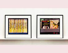 Load image into Gallery viewer, As part of Richard Heeps' series, A Short History of Milan, Delitto A Hollywood features a series of yellow Italian books from a street kiosk. 