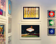 Load image into Gallery viewer, As part of Richard Heeps' series, A Short History of Milan, Delitto A Hollywood features a series of yellow Italian books from a street kiosk. 