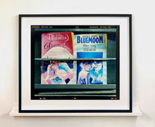 Load image into Gallery viewer, As part of Richard Heeps' series, A Short History of Milan, Desire features Italian books from a street kiosk. 