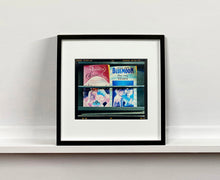 Load image into Gallery viewer, As part of Richard Heeps' series, A Short History of Milan, Desire features Italian books from a street kiosk. 