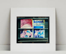 Load image into Gallery viewer, As part of Richard Heeps' series, A Short History of Milan, Desire features Italian books from a street kiosk. 