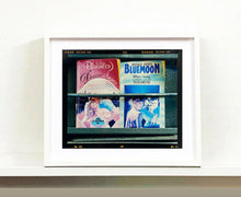 Load image into Gallery viewer, As part of Richard Heeps' series, A Short History of Milan, Desire features Italian books from a street kiosk. 