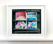 Load image into Gallery viewer, As part of Richard Heeps' series, A Short History of Milan, Desire features Italian books from a street kiosk. 