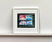 Load image into Gallery viewer, As part of Richard Heeps' series, A Short History of Milan, Desire features Italian books from a street kiosk. 