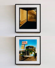 Load image into Gallery viewer, 'Door - Lariat Motel' is a cinematic scene showing a doorway in the glowing evening light, with the setting sun casting shadows across the architecture. Richard Heeps photographed this artwork in Fallon, Nevada whilst on an American road trip. This artwork is part of Richard's 'Dream in Colour' series. 