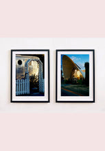 Load image into Gallery viewer, Part of Richard Heeps' 'Dream in Colour' series, this photograph features a white picket fence entrance to the Royal Mansion at the Shady Dell Trailer Park in Bisbee. Arizona. 