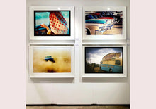 Load image into Gallery viewer, A moody Fenland sky is backdrop to a classic British Fish &amp; Chips Van. The typography and the van itself has a fun fairground feel, contrary to the muted tones of this piece. Part of Richard Heeps series, 'A View of the Fens from the Car with Wings'.