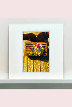 Load image into Gallery viewer, This stylish artwork, 'Floral Wicker Bag' taken at the glamorous retro event Goodwood Revival in Chichester, perfectly captures feminine sophistication with a vintage vibe.