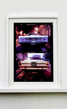 Load image into Gallery viewer,  A classic white Ford Taurus, photographed on the streets of Turro, Milan. 