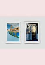 Load image into Gallery viewer, Part of Richard Heeps' 'Dream in Colour' series, this photograph features a white picket fence entrance to the Royal Mansion at the Shady Dell Trailer Park in Bisbee. Arizona. 