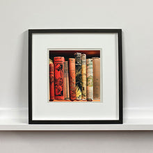 Load image into Gallery viewer, Framed photograph of vintage book spines by Richard Heeps.