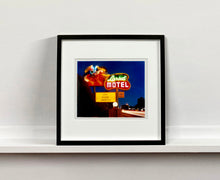 Load image into Gallery viewer, 'Lariat Motel II' is a classic Richard Heeps Americana 'Sign Porn' artwork. It was captured in its original site in Fallon, Nevada. The owners since sold the Lariat Motel and donated the 1950's sign with original neon tubing to the Churchill Arts Council. This photograph forms part of Richard Heeps' 'Dream in Colour' series.