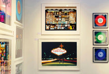 Load image into Gallery viewer, Taken upon leaving Las Vegas, and featured in Richard Heeps' 'Dream in Colour' series, this piece features a classic American neon sign, with the Las Vegas lights disappearing into the distance. 