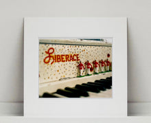 Load image into Gallery viewer, 'Liberace's Piano I' was photographed in a private Las Vegas home. The studded gems and decorative typography make for an archetypal Las Vegas feel. This artwork is part of Richard Heeps' 'Dream in Colour' series. 