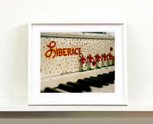 Load image into Gallery viewer, 'Liberace's Piano I' was photographed in a private Las Vegas home. The studded gems and decorative typography make for an archetypal Las Vegas feel. This artwork is part of Richard Heeps' 'Dream in Colour' series. 