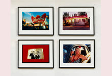 Load image into Gallery viewer, 'Magic Act' is a sepia toned vintage image laid on a bright red backdrop. This photograph was captured at the Red Lodge, a stop often used by performers as they traveled across the country.