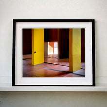 Load image into Gallery viewer, Monte Amiata housing, Gallaratese Quarter, Milan. Yellow brutalist architecture photograph by Richard Heeps framed in black.