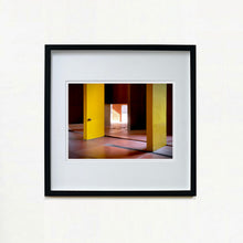 Load image into Gallery viewer, Monte Amiata housing, Gallaratese Quarter, Milan. Yellow brutalist architecture photograph by Richard Heeps framed in black.